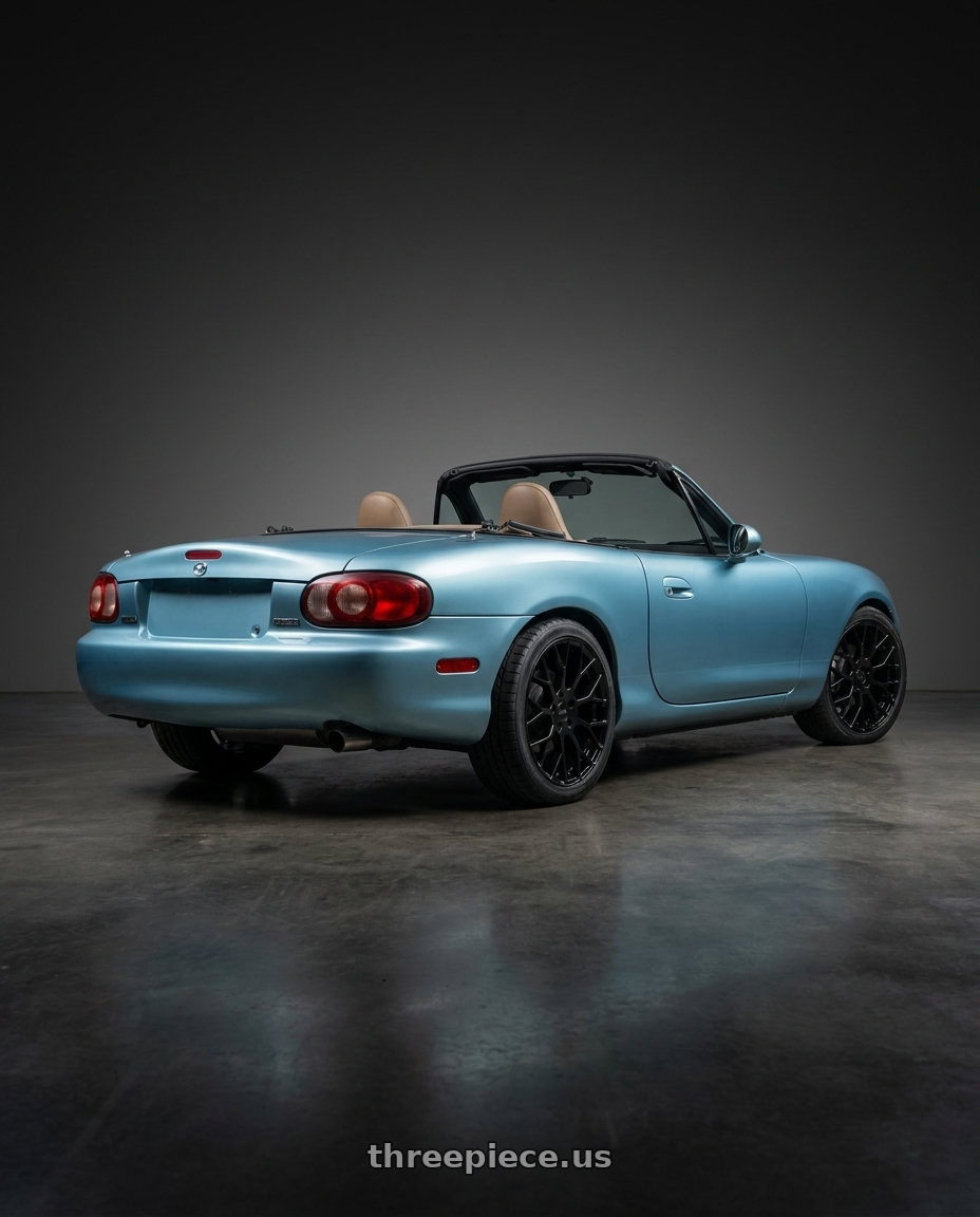 2002 Mazda Miata with Petrol P2B 4X100 15X7 +40 GLOSS BLACK wheels rear three quarter view square tires