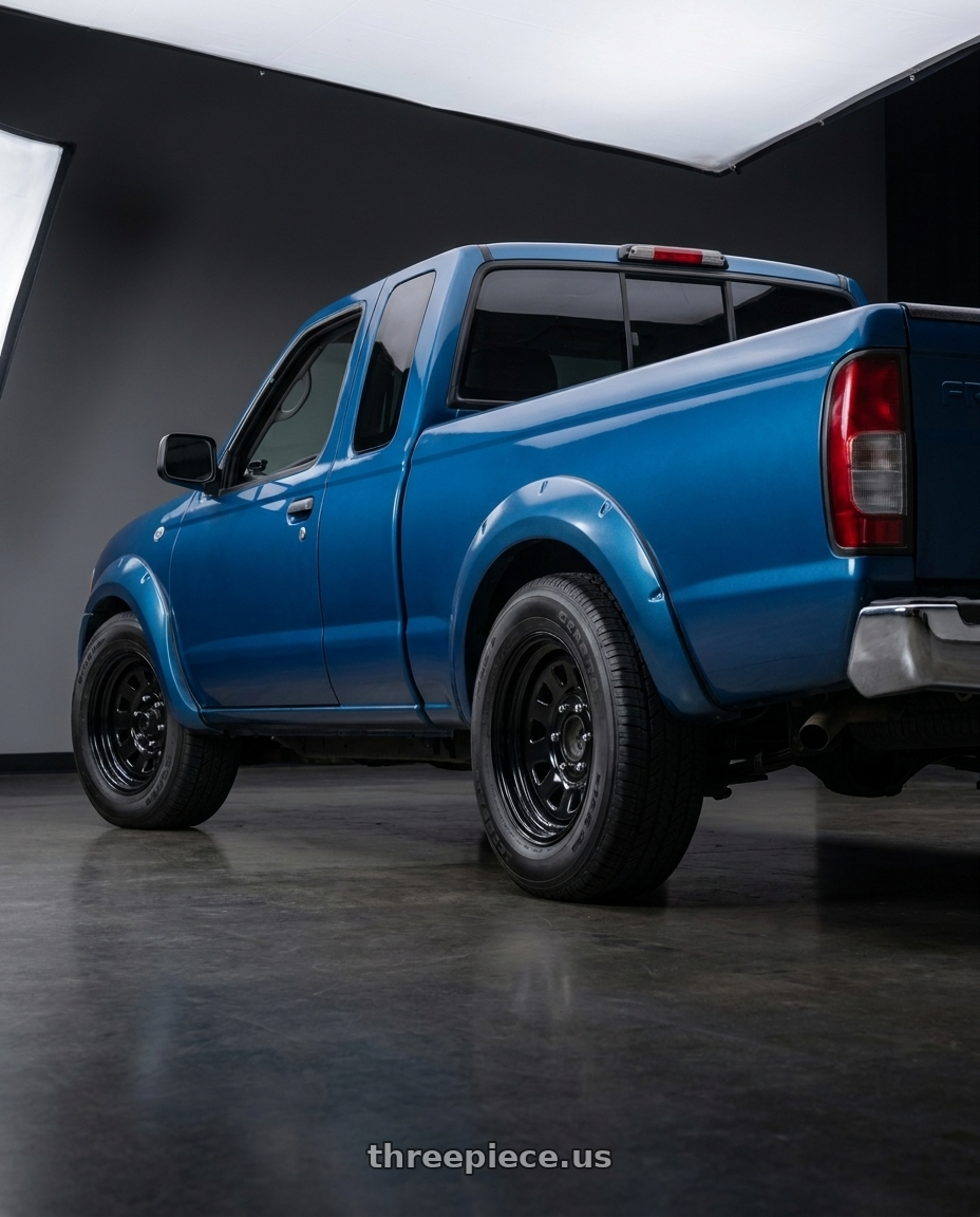 2002 Nissan Frontier with Vision HD 84H 6x139.7 15x7-6 Gloss Black wheels rear three quarter view square tires