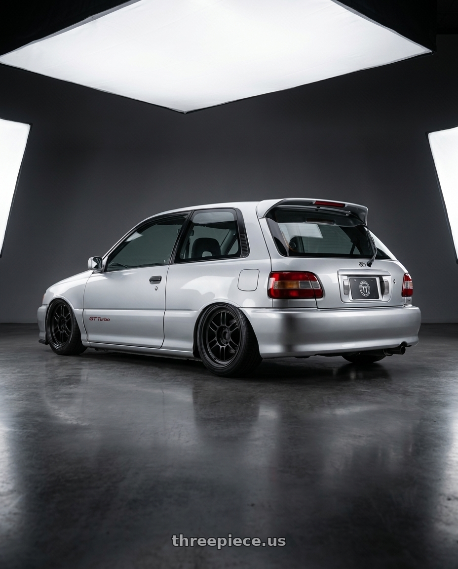 1994 Starlet gt turbo with Enkei RPF1 4x100 15x7+35 Black wheels rear three quarter view slight stretch tires