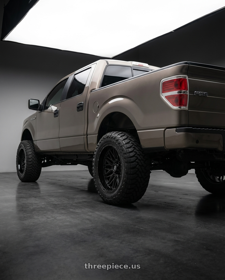 2013 Ford F-150 with Gear Off Road 770B 6X135/6x139.7 22x12 -44 GLOSS BLACK wheels rear three quarter view meaty tires