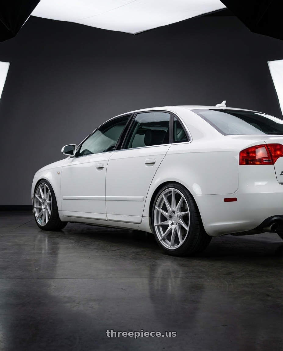 2010 Audi A4 B7 with Aodhan AH09 5x112 18x9.5 +35 Gloss Silver Machined Face wheels rear three quarter view square tires