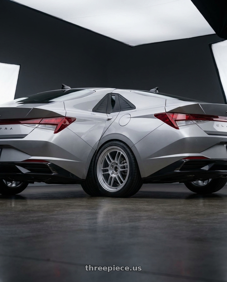 2021 Hyundai Elantra Limited with Enkei RPF1 5x114.3 18x9+35 Silver wheels rear three quarter view square tires