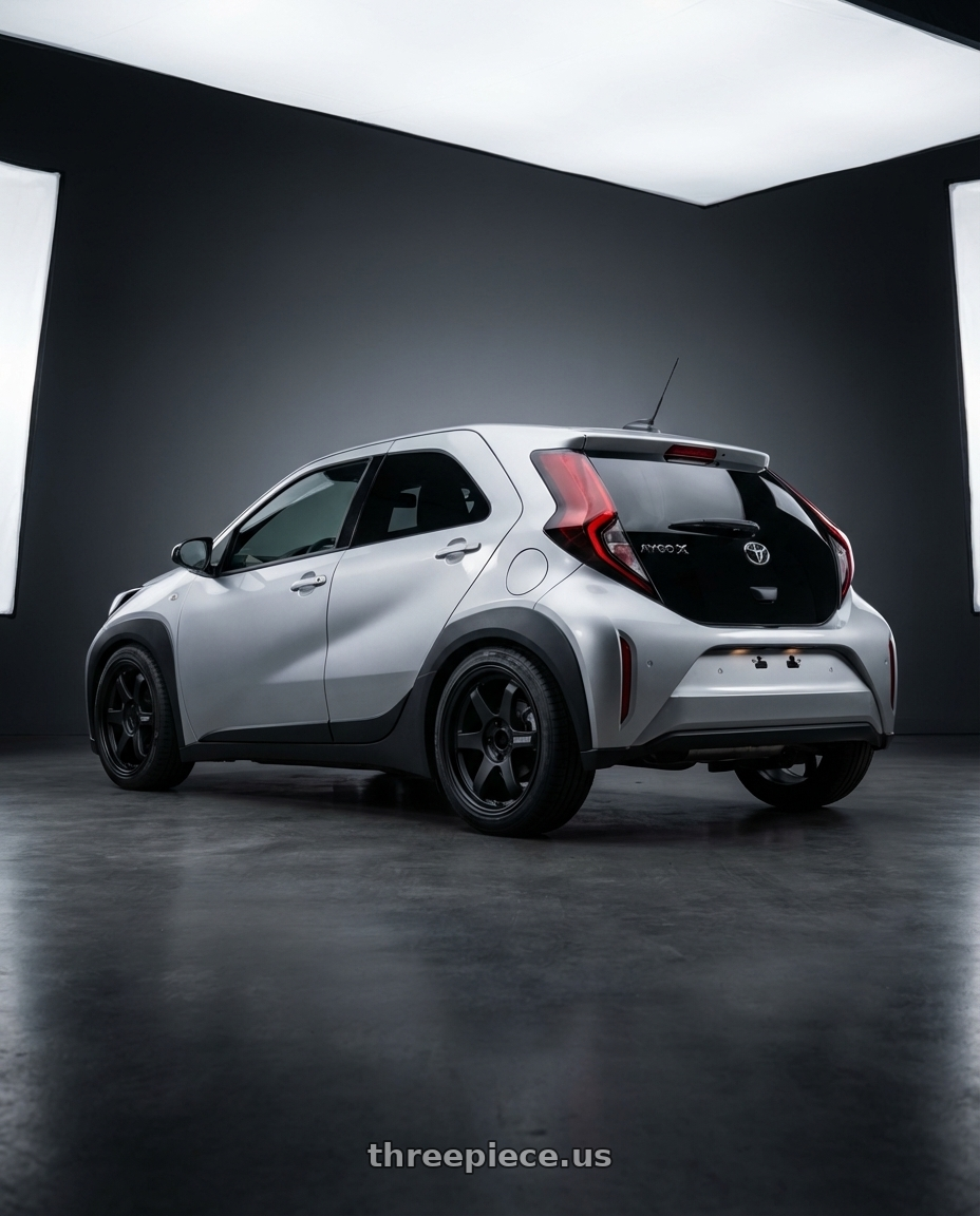 Toyota Aygo X 2025 with Volk Racing RAYS D108 6x139.7 17x8 +0 MATTE BLACK wheels rear three quarter view square tires