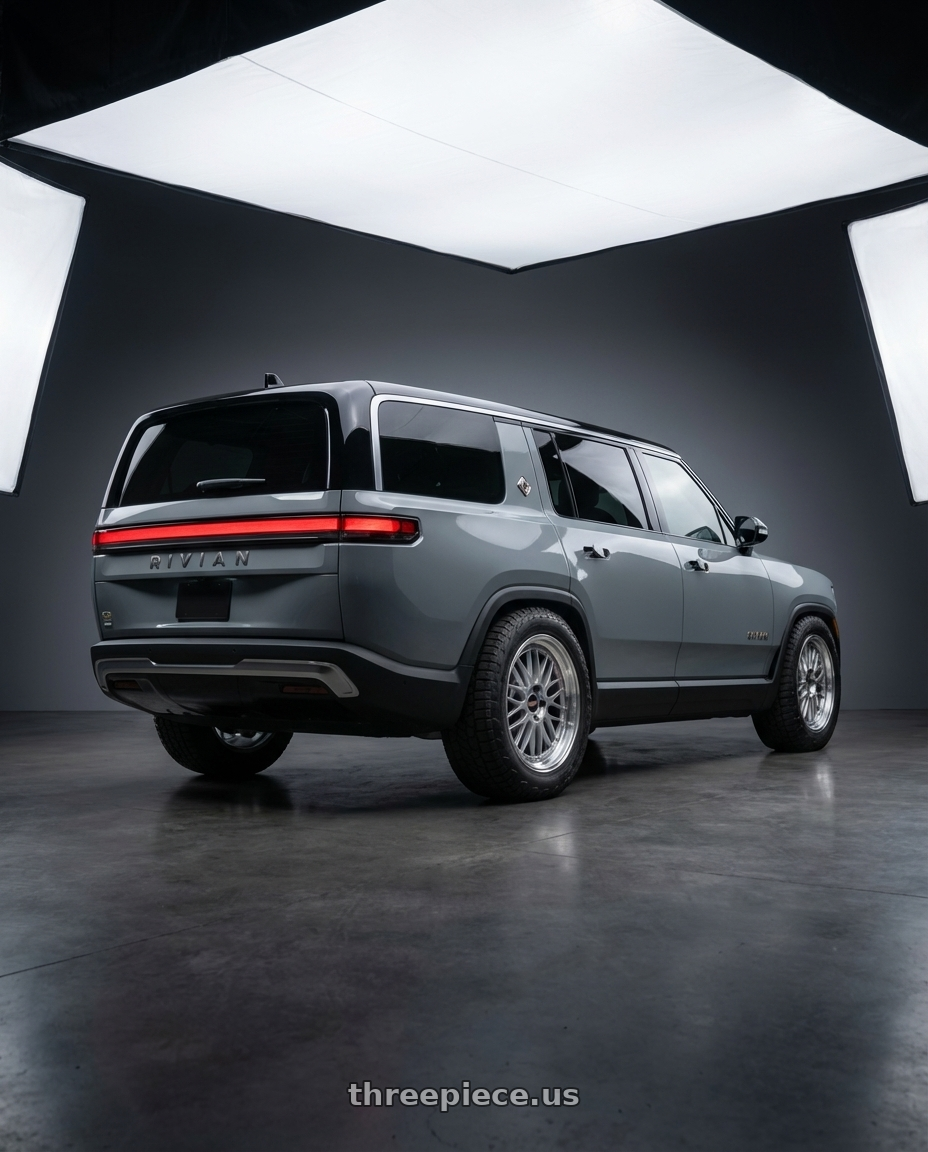 2025 Rivian R1S with BBS LM 5x120 21x9.0+32 Diamond Silver wheels rear three quarter view meaty tires