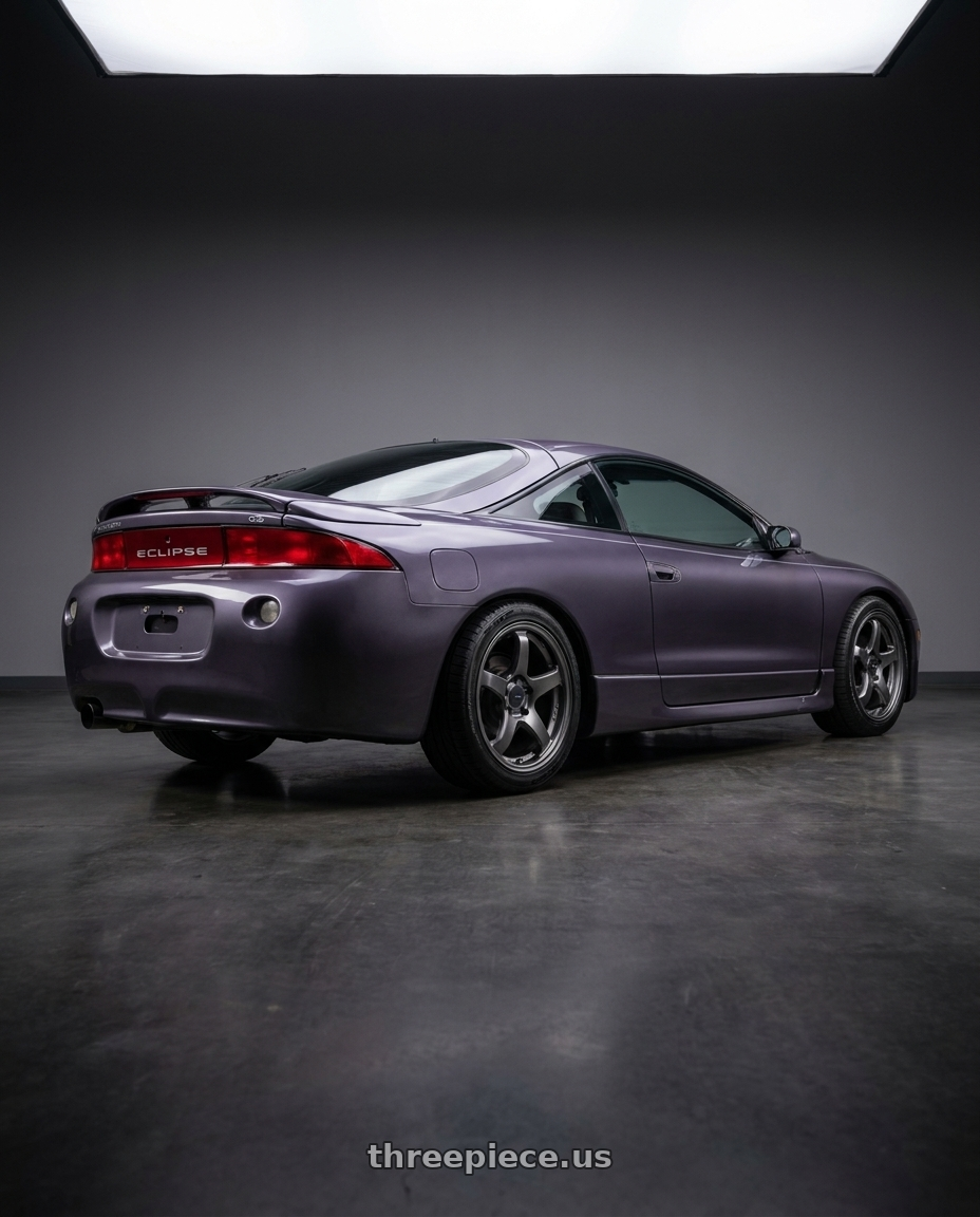 1997 Mitsubishi Eclipse with Enkei PF05 5x114.3 17x7+45 Dark Silver wheels rear three quarter view square tires