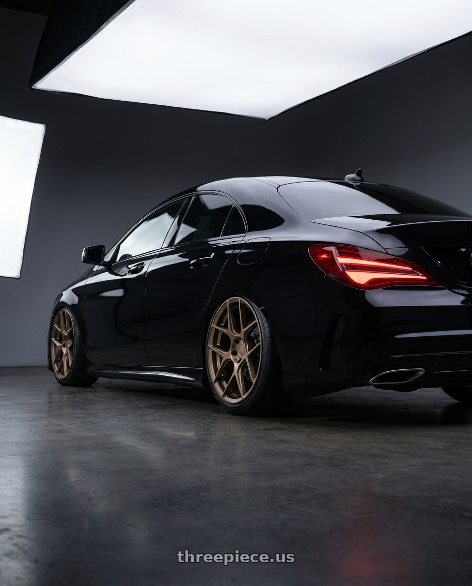 2018 Mercedes-Benz CLA C117 with Aodhan AFF2 5x112 19x8.5+35 Matte Bronze wheels rear three quarter view slight stretch tires