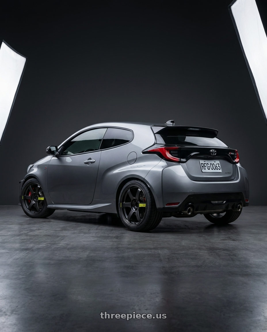 GR Yaris 2026 with Volk Racing TE37 Saga SL M-Spec 5x114.3 18x8.5+38 Pressed Black wheels rear three quarter view square tires