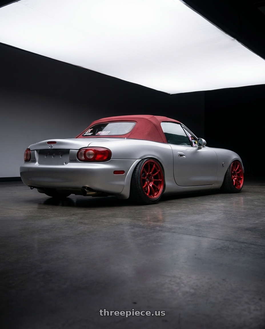 2000 Mazda Miata with Volk Racing ZE40 M-SPEC 5x114.3 19x10.5+32 Hyper Red wheels rear three quarter view extreme stretch tires