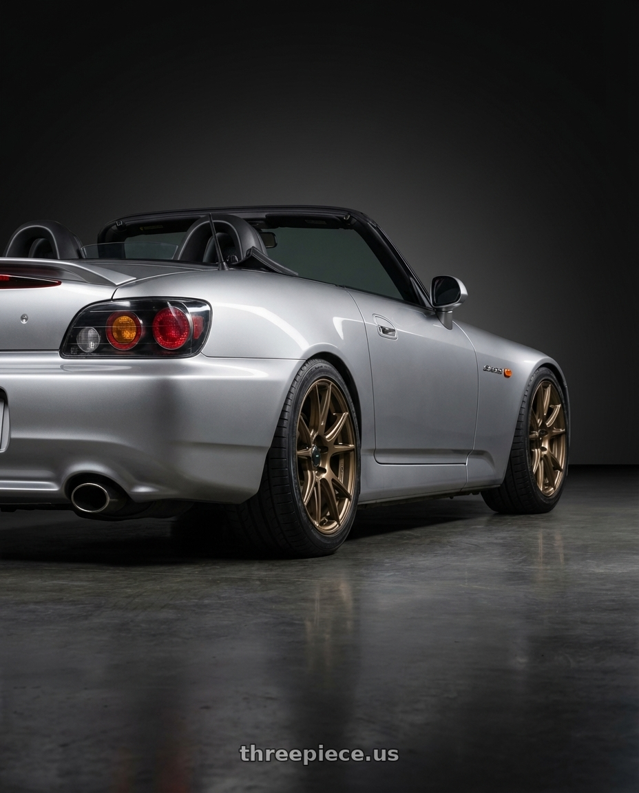 2009 Honda S2000 with Konig Ampliform 5x114.3 17x9+40 Gloss Bronze wheels rear three quarter view square tires