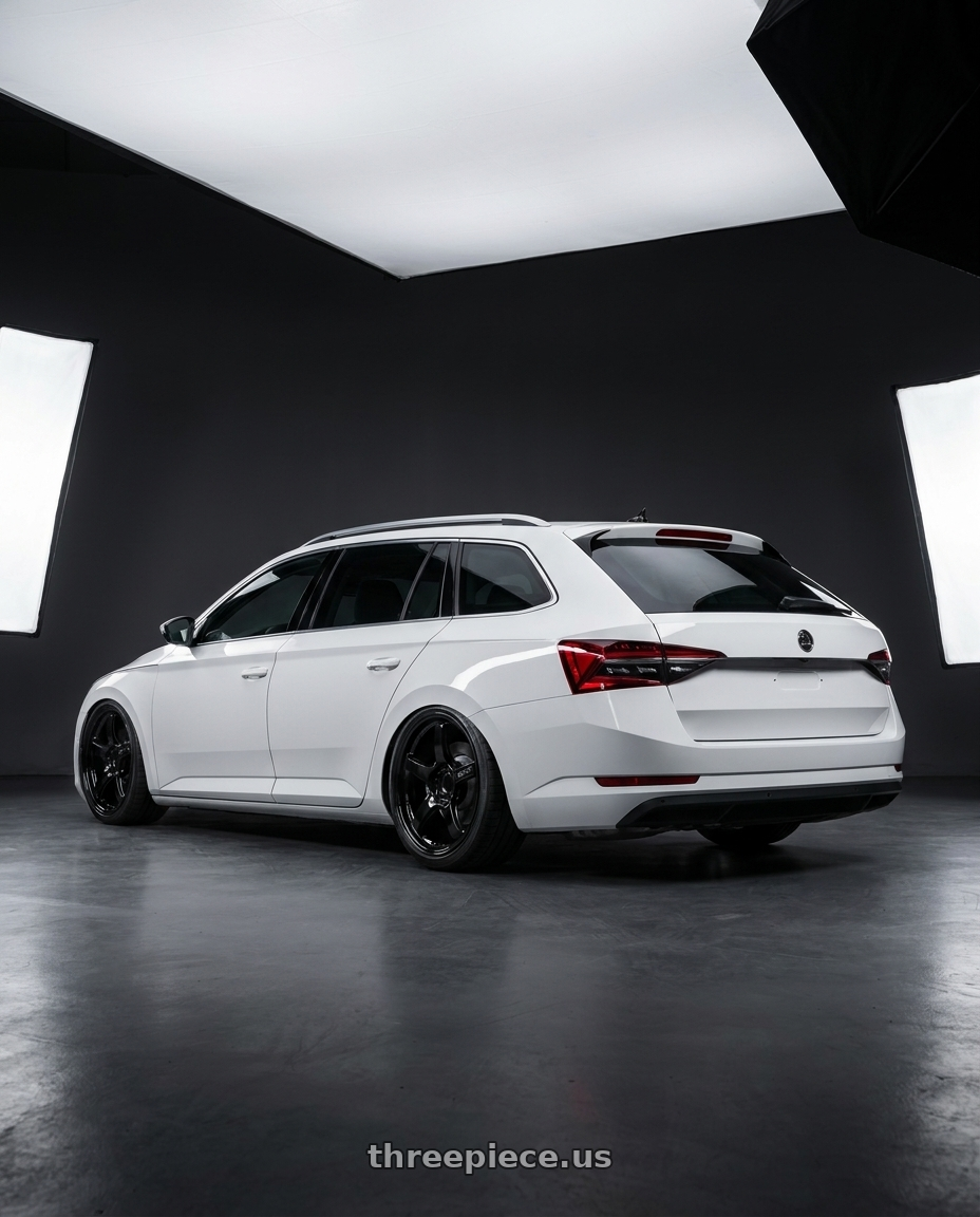 2022 Superb Combi with Gram Lights 57CR 5x112 19x10.5+22 Glossy Black wheels rear three quarter view slight stretch tires