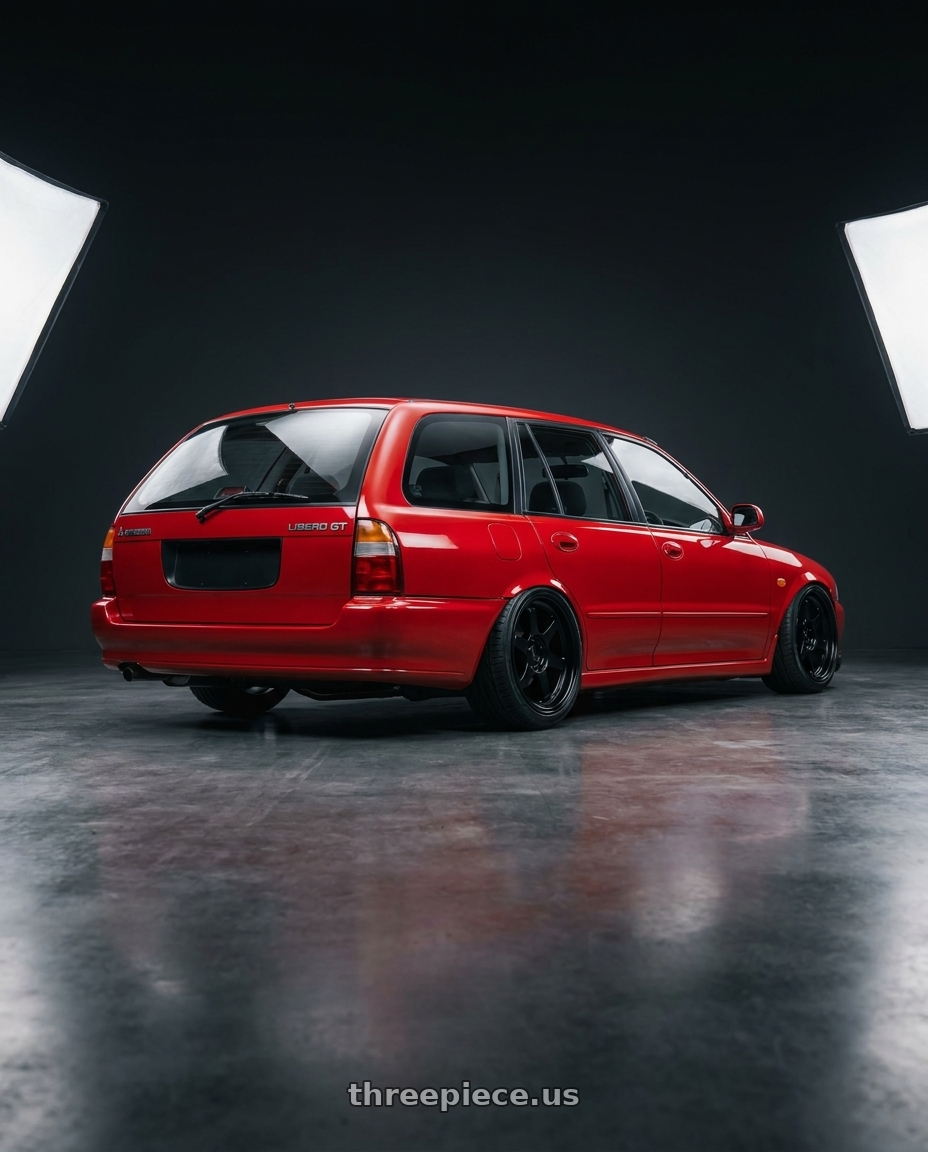 1992 Mitsubishi Libero GT with Enkei Overlander 5x100 18x8+35 Black wheels rear three quarter view slight stretch tires