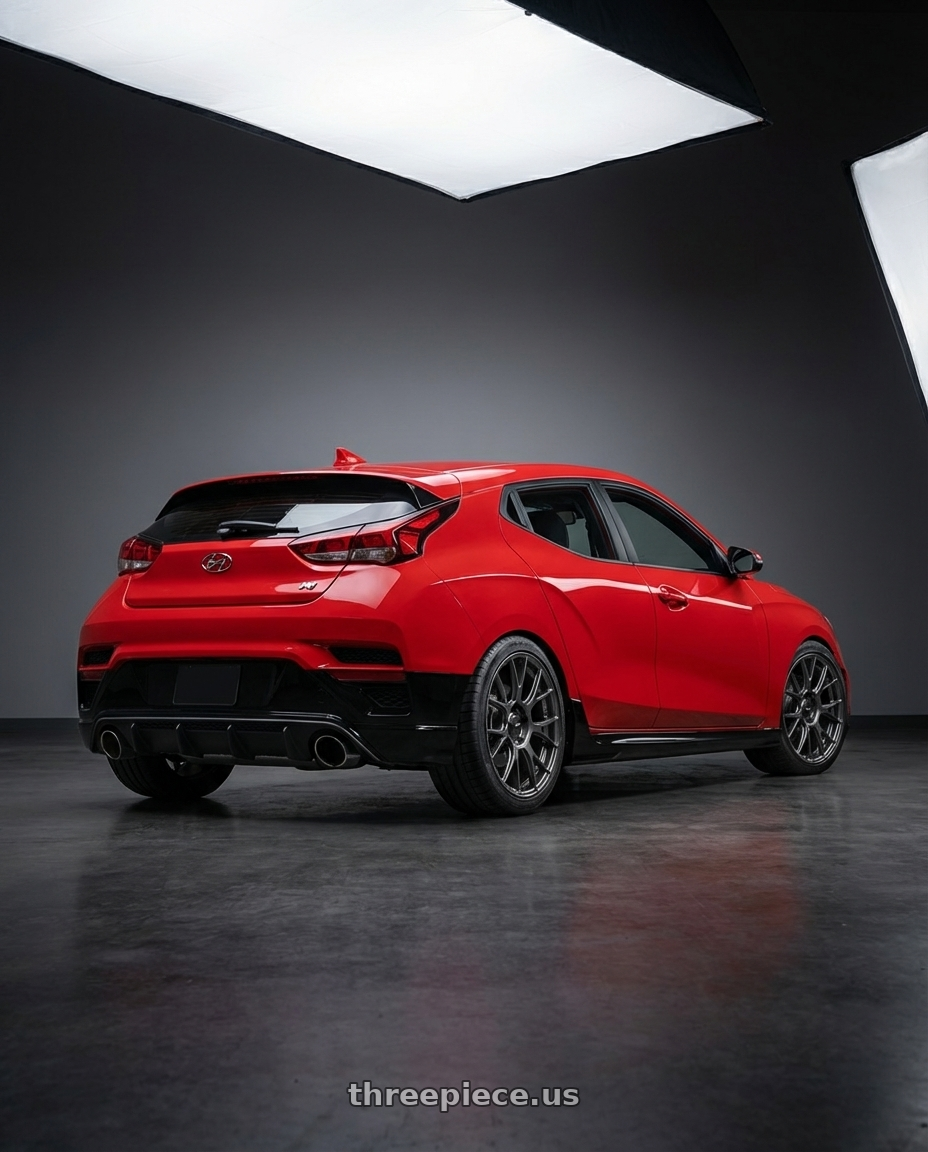 2022 Hyundai Veloster N with Konig Ampliform 5x114.3 19x8.5+30 Dark Metallic Graphite wheels rear three quarter view square tires