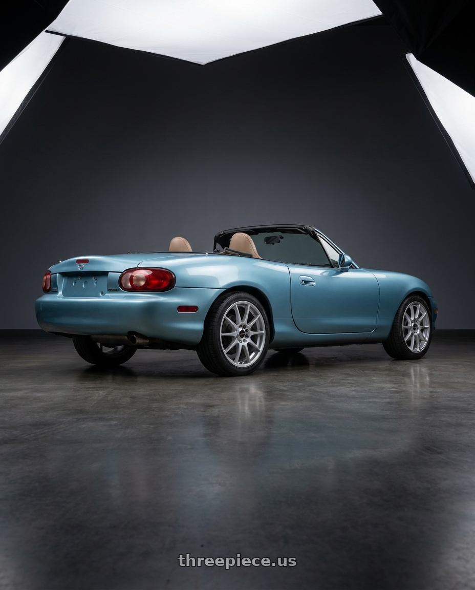 2002 Mazda Miata with Vision Street-Designs 425 Bane 4x100 15x6.5+38 Hyper Silver wheels rear three quarter view square tires