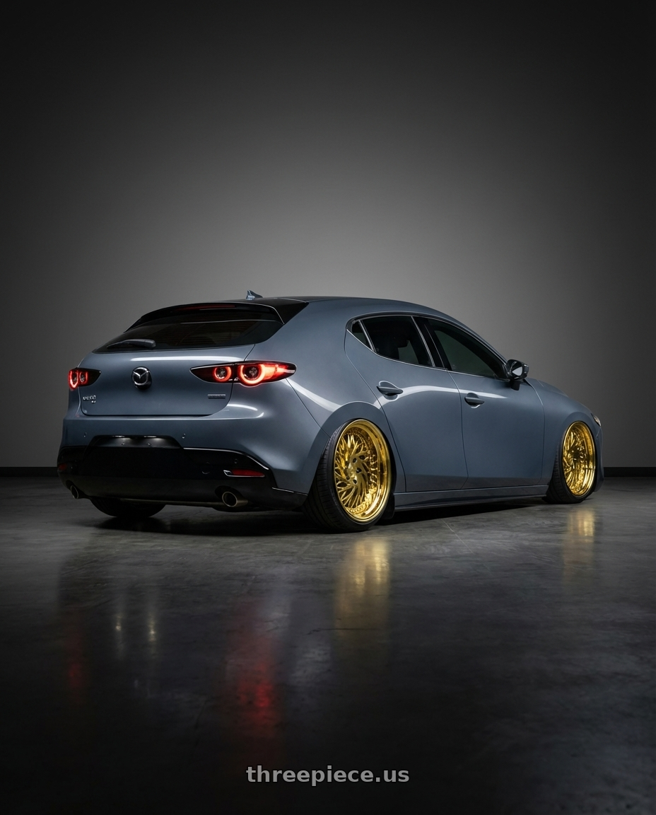 2023 Mazda Mazda3 Turbo with Aodhan DS03 5x114.3 18x9.5 +30 Gold Vacuum w/ Chrome Rivets wheels rear three quarter view slight stretch tires