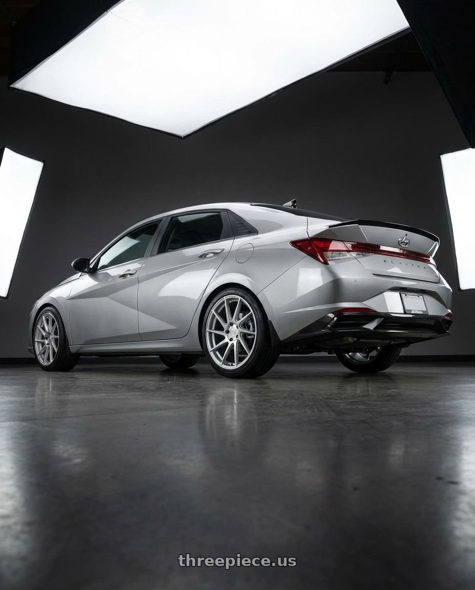 2021 Hyundai Elantra Limited with Aodhan AH09 5x114.3 18x8.5 +35 Gloss Silver Machined Face wheels rear three quarter view square tires