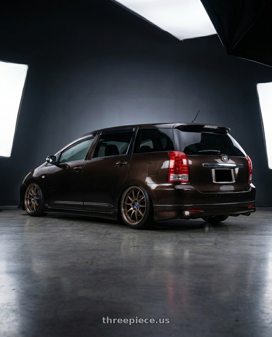 2008 toyota wish, dark brown  with Work Emotion D9r 5x100 18x8.5 +47 Matte Bronze wheels rear three quarter view slight stretch tires