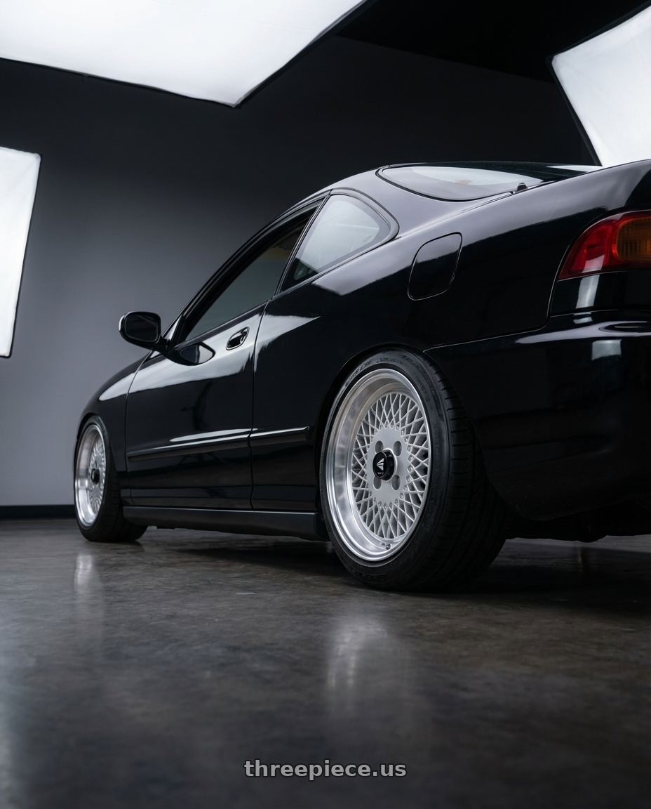 1998 Acura Integra with Enkei Enkei92 Classic Line 4x100 15x7+38 Silver wheels rear three quarter view square tires