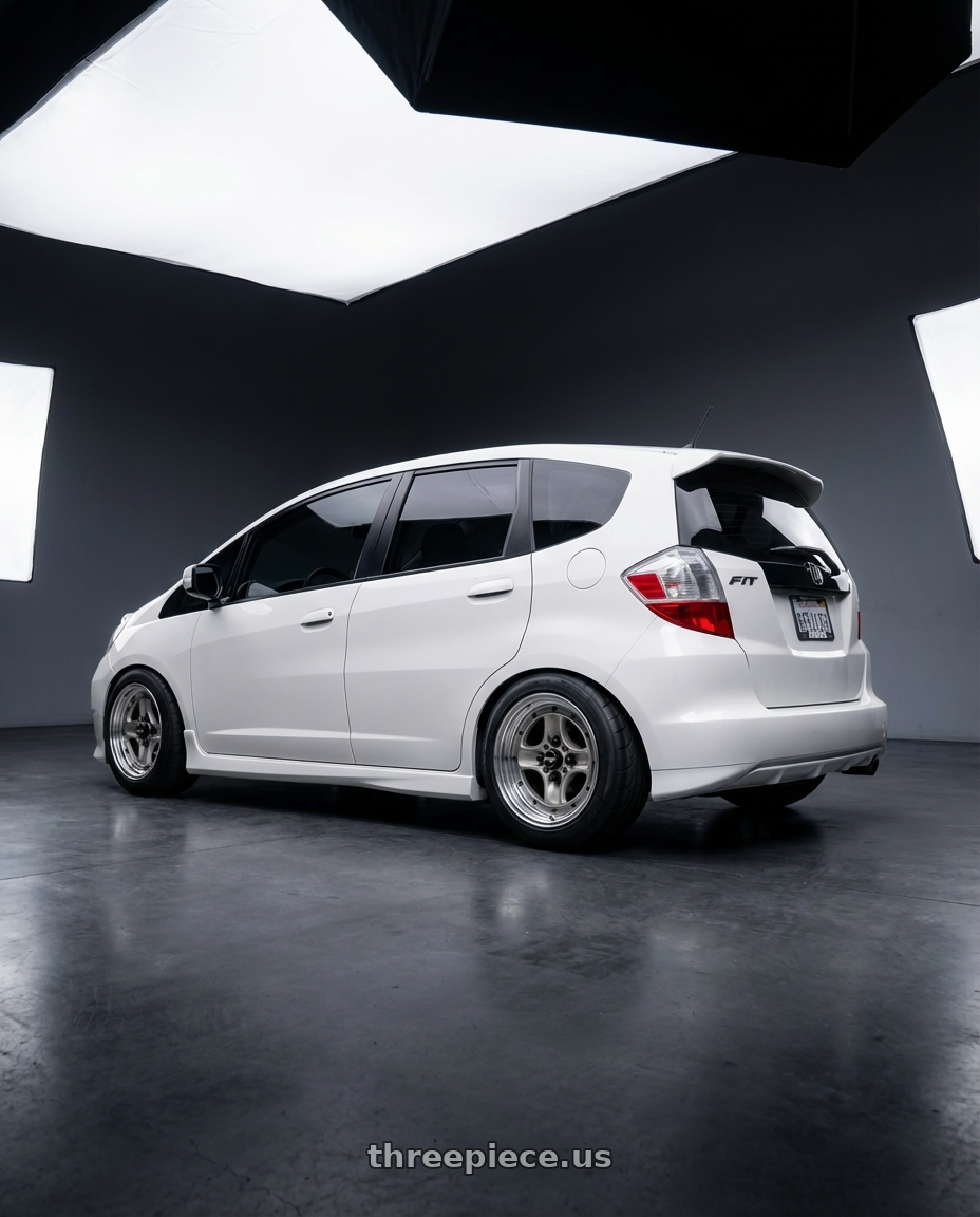 2013 Honda fit  with Work Equip 40 4x100 15x6.5 +26 o disk Brut Silver wheels rear three quarter view meaty tires