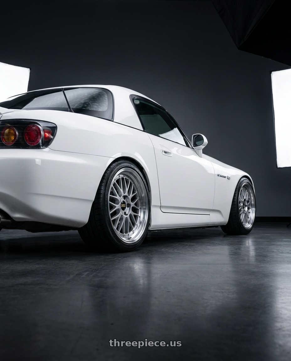 2006 Honda s2000 with BBS LM 5x114.3 18x10.0+20 Diamond Silver wheels rear three quarter view square tires