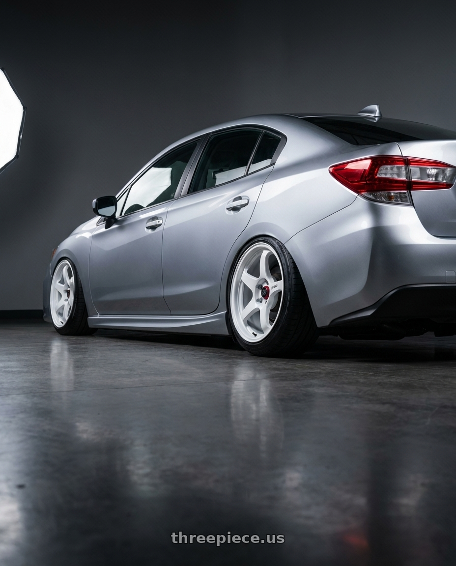 2017 Subaru Impreza 2.0 GK with Enkei PF06 5x100 18x9.5+40 Black Machined wheels rear three quarter view slight stretch tires