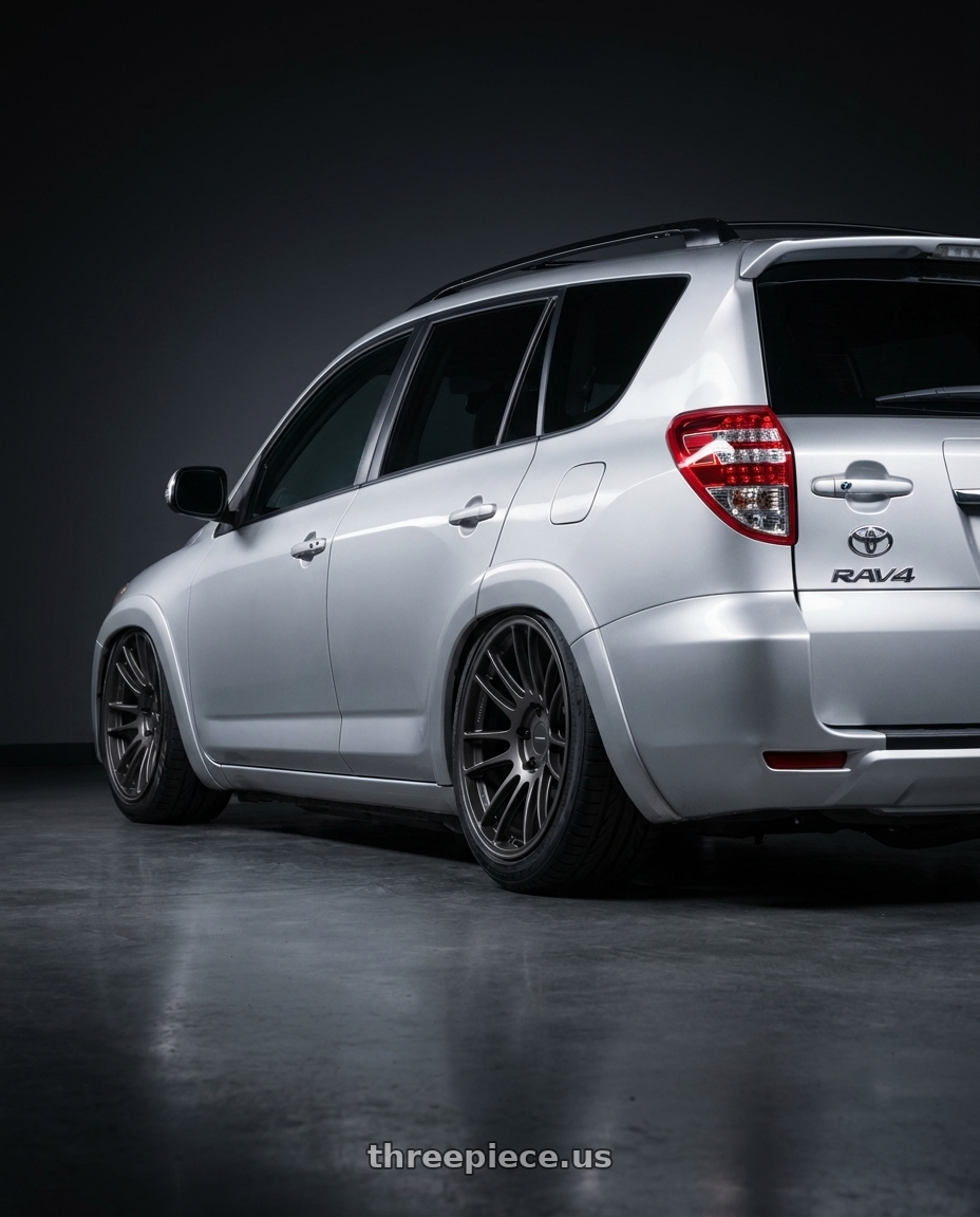 2013 Toyota RAV4 EV with Enkei GTC01RR 5x114.3 18x9.5+45 Matte Gunmetallic wheels rear three quarter view slight stretch tires