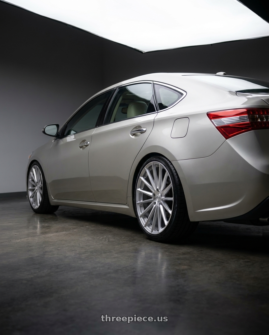 2013 toyota avalon with OHM PROTON 5X114.3 18X8.5 +30 SILVER W/ MIRROR FACE wheels rear three quarter view slight stretch tires