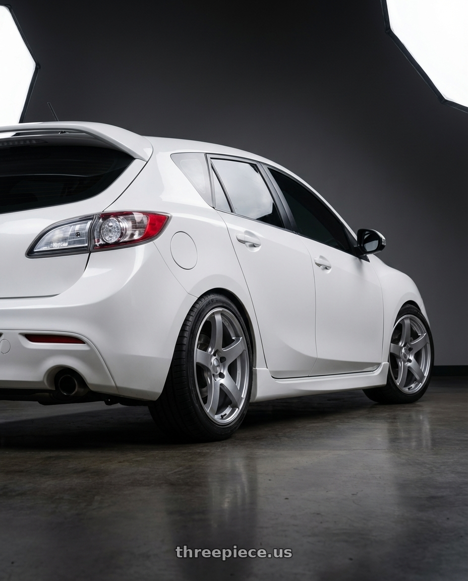 2012 Mazda Mazdaspeed3 with Ssr Gtv01 5x114.3 18x9+35  GLARE SILVER wheels rear three quarter view square tires