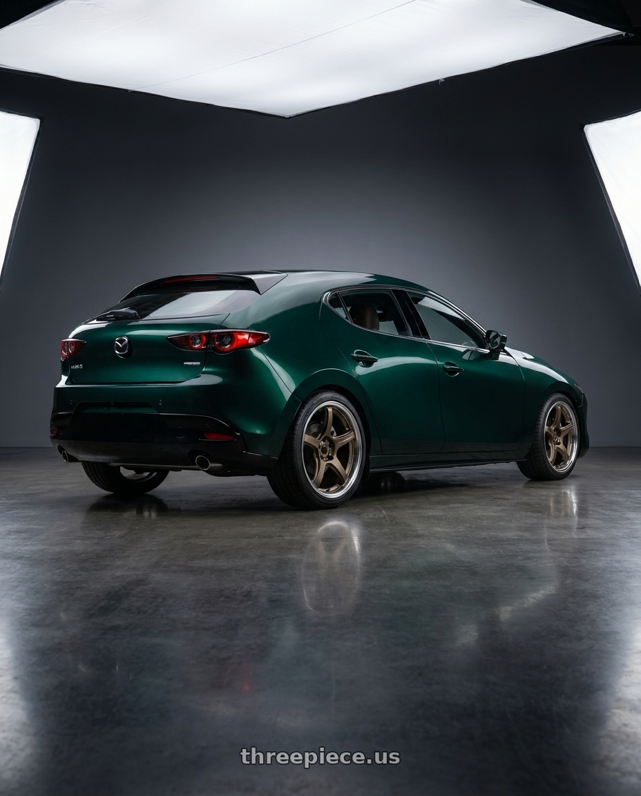 2026 Mazda 3 with Work T5R 2P 5x114.3 18x8.5 +38 Matte Bronze wheels rear three quarter view square tires