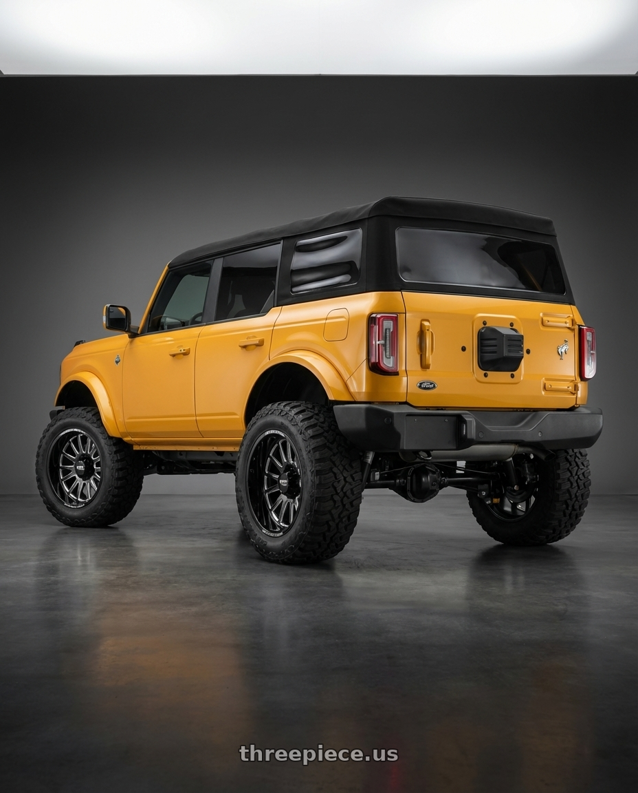 2024 Ford Bronco with Moto Metal MO401 6X139.7 20X10 -24 GLOSS BLACK MILLED wheels rear three quarter view meaty tires