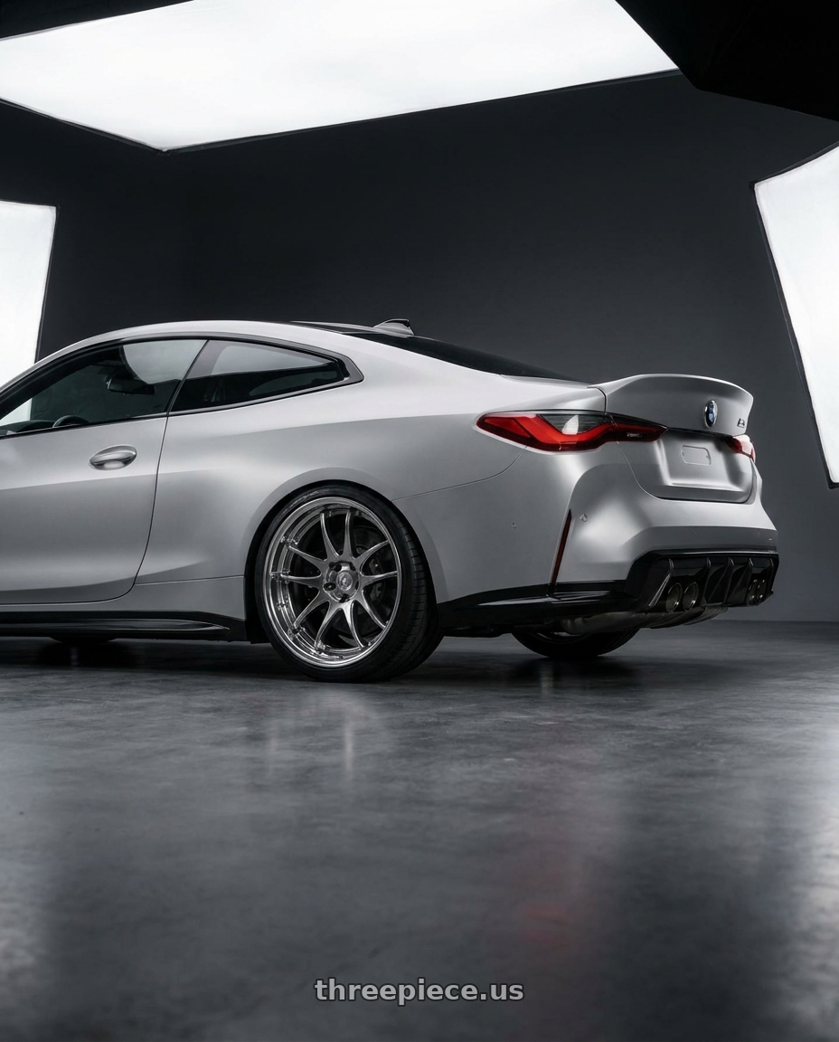 2027 BMW M4 Competition X-Drive with Work Cr 2P 5x112 20x11.0 +22 GT Silver wheels rear three quarter view square tires