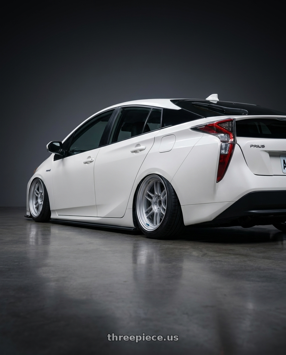 2017 Toyota Prius  with Enkei RPF1RS 5x114.3 18x9.5+12 Silver wheels rear three quarter view square tires