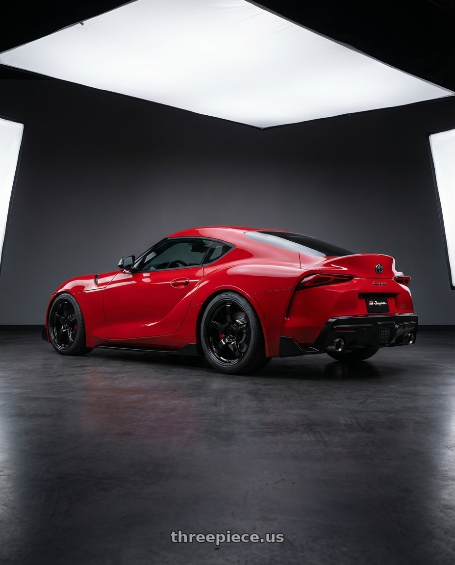 2023 Toyota GR Supra with Gram Lights 57CR 5x112 19x9.5+25 Glossy Black wheels rear three quarter view square tires