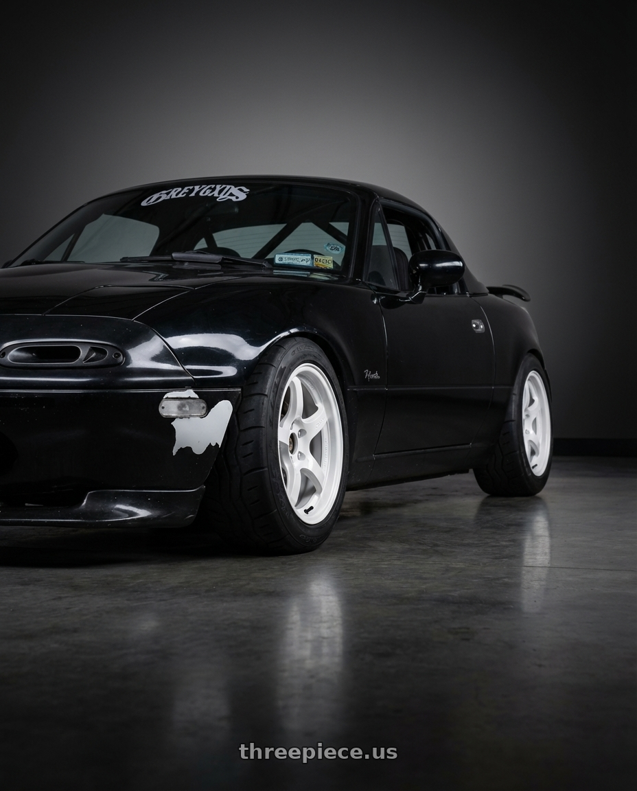 1992 Mazda Miata Limited with Gram Lights 57CR 4x100 15x8 +28 CERAMIC PEARL wheels rear three quarter view meaty tires