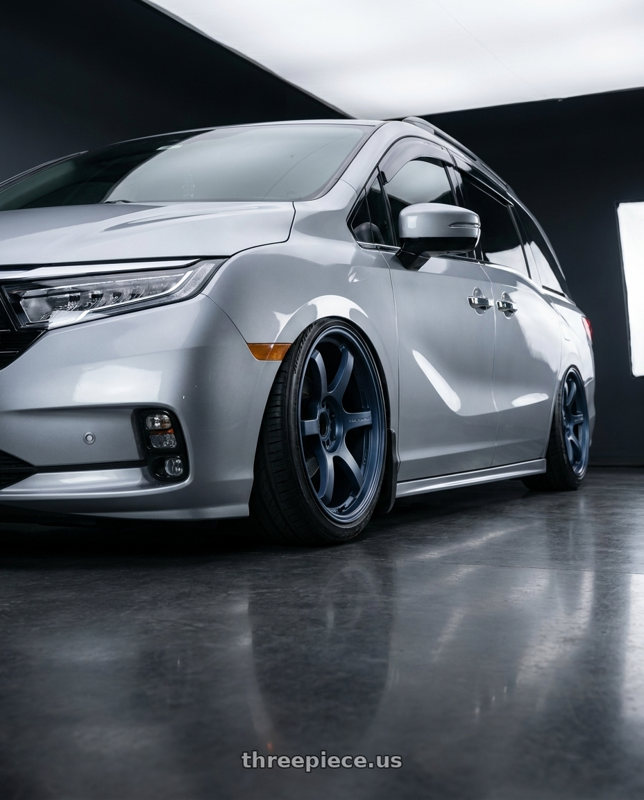 2024 Honda Odyssey with Gram Lights 57DR 5x120 19x8.5 +45 GUNBLUE 2 wheels rear three quarter view extreme stretch tires