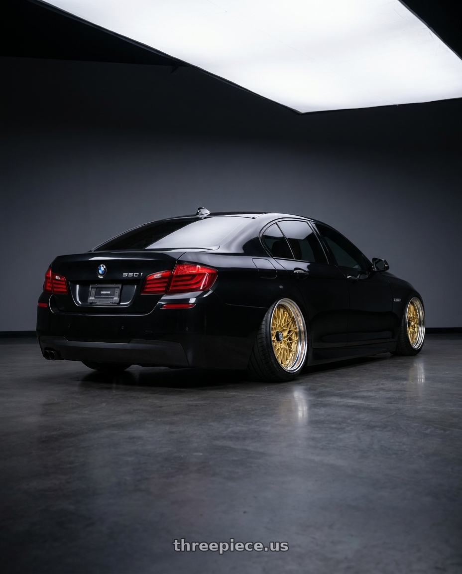 2013 BMW 550i with SSR Formula MESH 5x108 19X12.5+-3 MD Disk Fm Gold wheels rear three quarter view extreme stretch tires