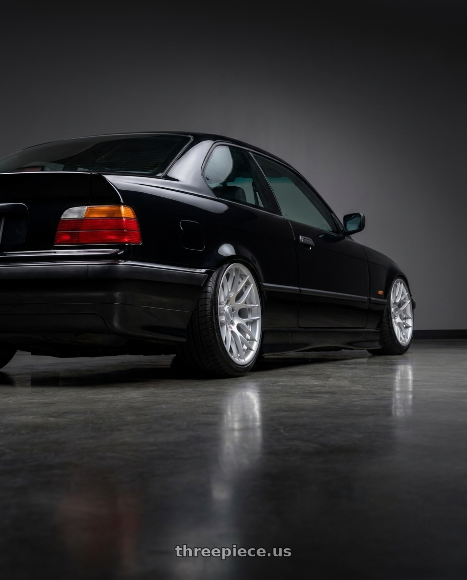 1994 BMW 325i with Avant Garde Wheels M359 5X120 18x9.5 +22 Hyper Silver wheels rear three quarter view slight stretch tires