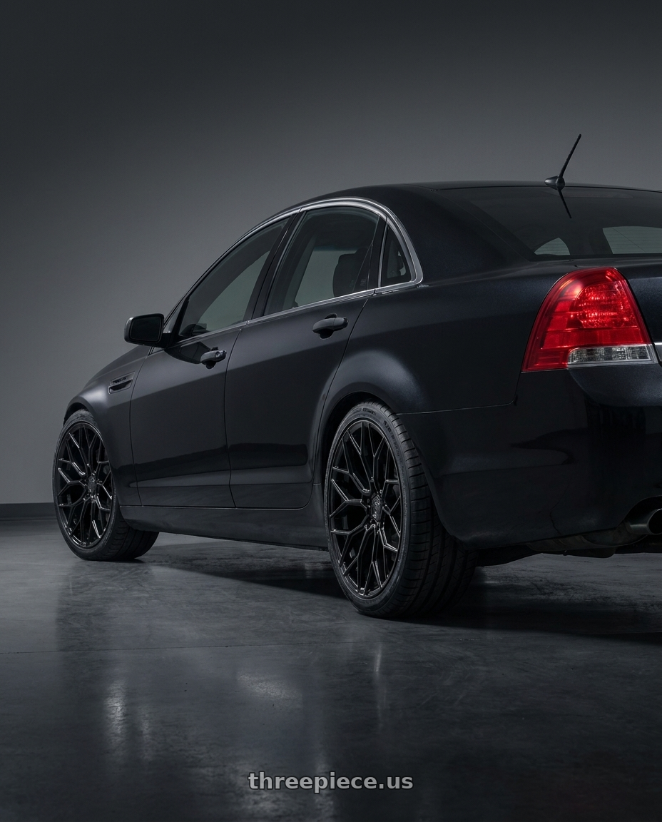 2014 Chevrolet Caprice PPV with DOLCE PERFORMANCE PISTA 5x120 19x9.5 +40 Gloss Black wheels rear three quarter view square tires