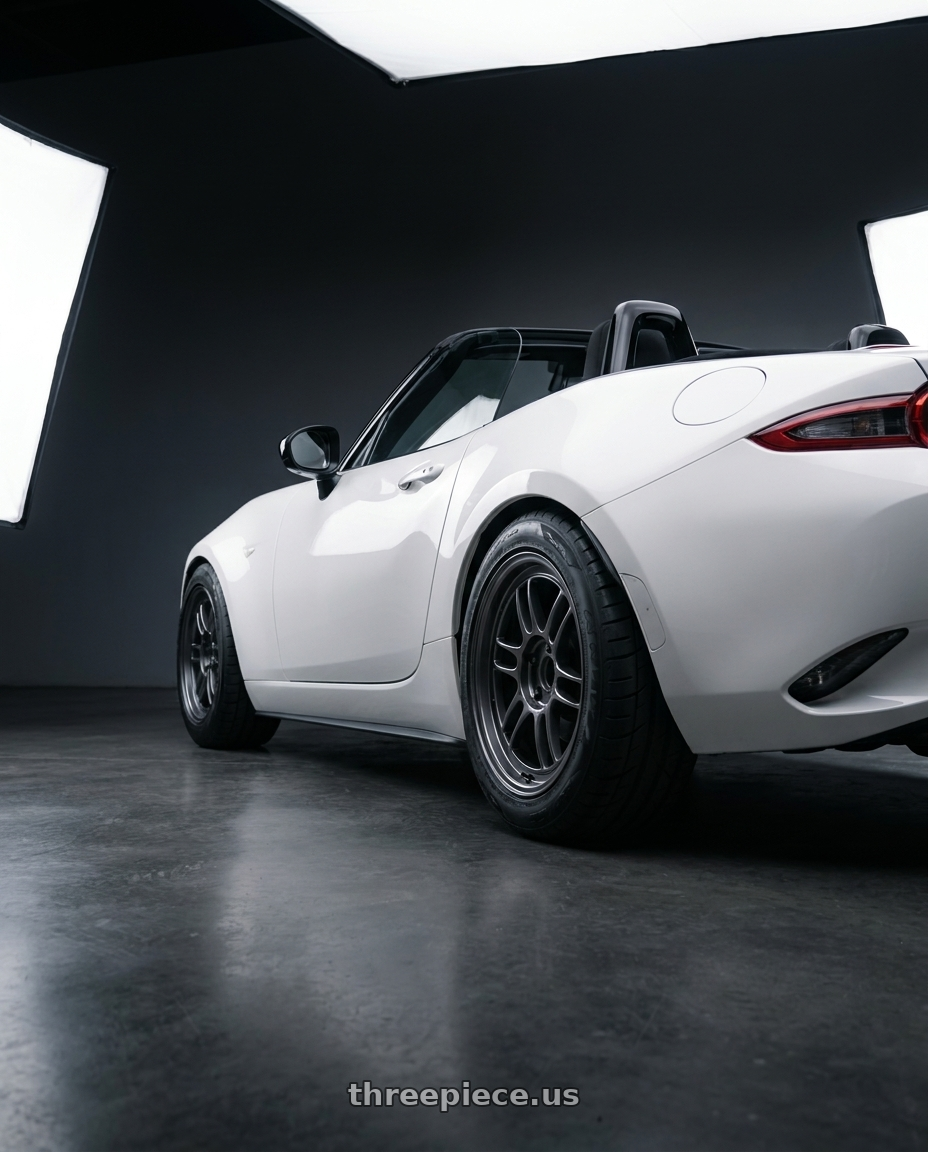 2024 nd mx5 soft top with Enkei RPF1 4x100 15x8+28 Gunmetal wheels rear three quarter view meaty tires