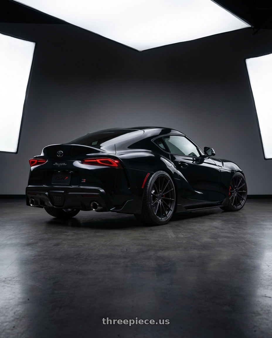 2026 toyota Supra final edition nocturnal black with TSW TW005 GOODWOOD 5X112 19x10.5 +35 MATTE BLACK wheels rear three quarter view square tires
