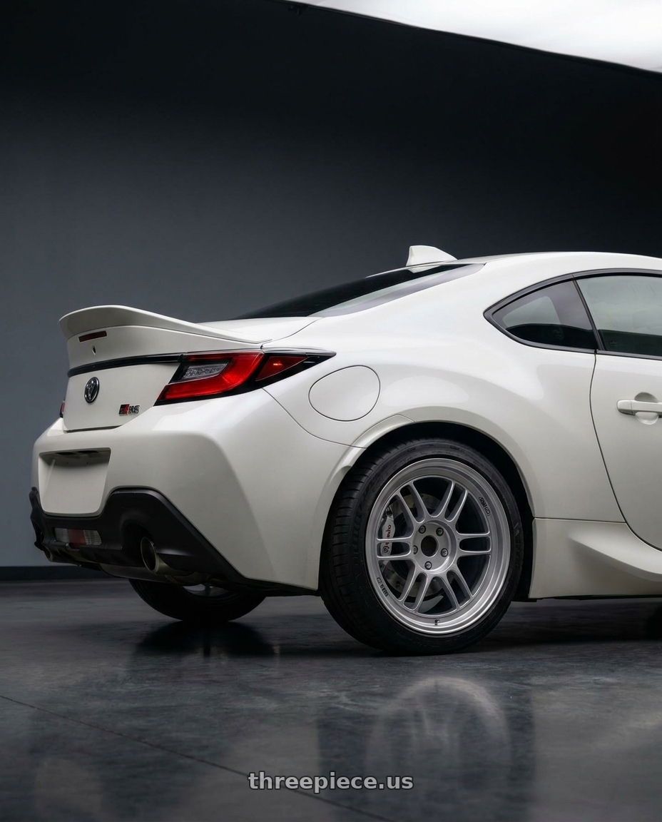 2026 Toyota GR86 Premium with Brembo Brakes with Enkei RPF1 5x100 17x8+45 Silver wheels rear three quarter view square tires