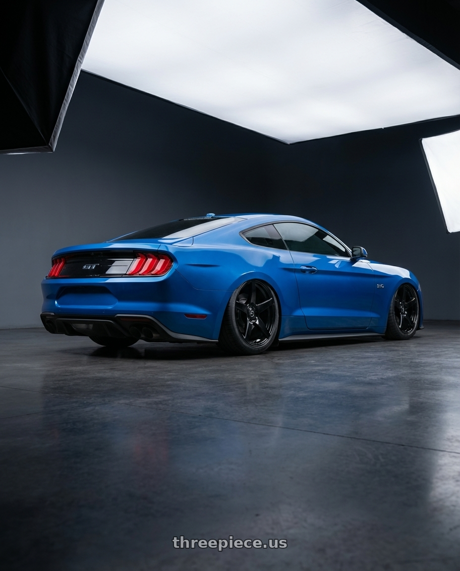 2022 Ford Mustang GT with Forgestar CF5 5x114.3 20x9.5 +29 Gloss Black wheels rear three quarter view slight stretch tires