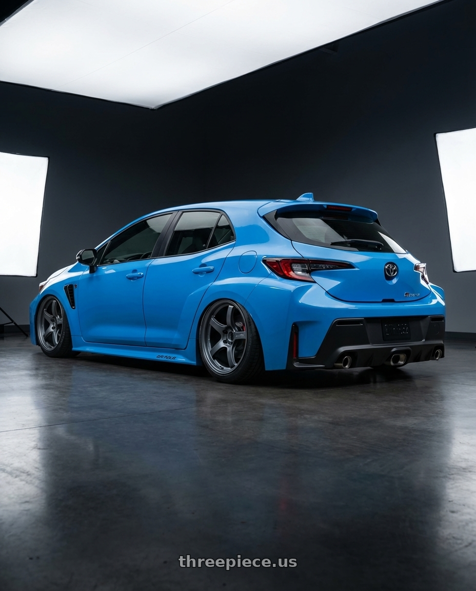 2024 Toyota GR Corolla with Gram Lights 57CR 5x114.3 18x9.5+38 Gunblue II wheels rear three quarter view slight stretch tires