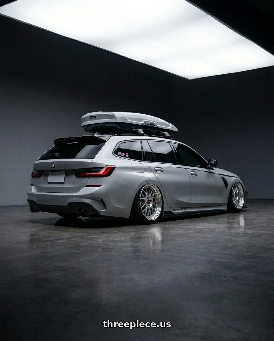 2021 BMW G21 with BBS RG-F 4x100 15x7 +33 Sport Silver wheels rear three quarter view extreme stretch tires