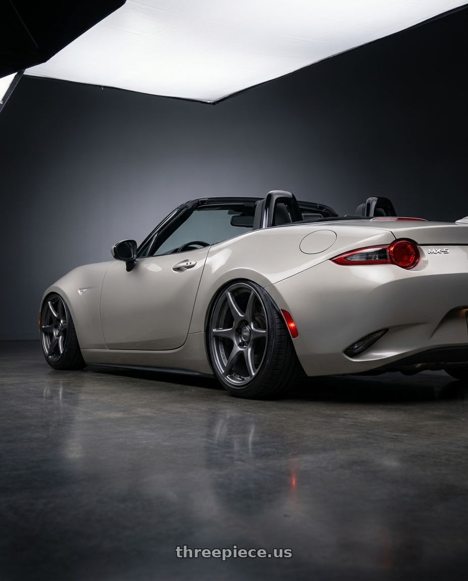 2021 Mazda MX-5 Miata ND with Kansei K11G Tandem 5x114.3 17x9.5 12 Gunmetal wheels rear three quarter view slight stretch tires