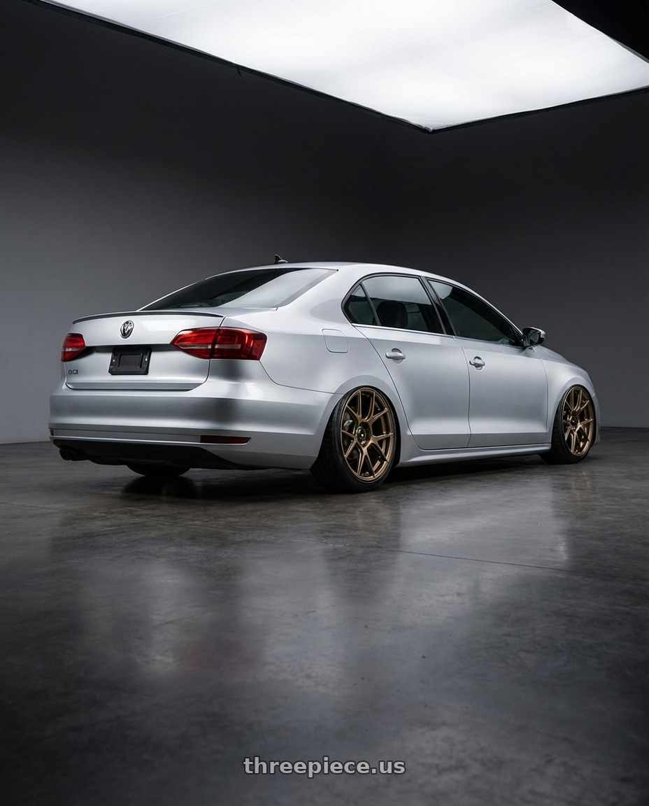 2016 Volkswagen Jetta GLI MK6 with Konig Ampliform 5x112 18x8.5+43 Gloss Bronze wheels rear three quarter view slight stretch tires