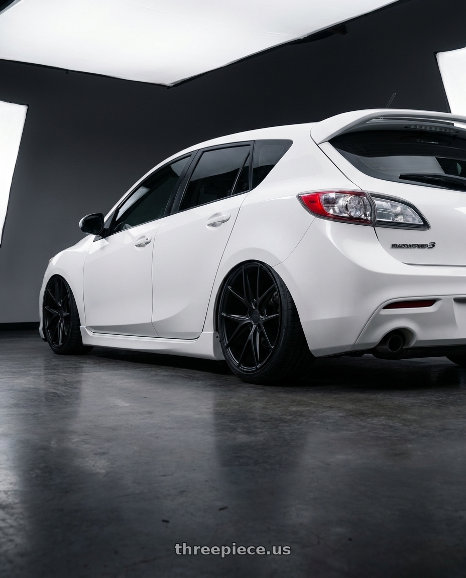 2012 Mazda Mazdaspeed3 with Niche 1PC M117 MISANO 5X114.3 18X8 +40 MATTE BLACK wheels rear three quarter view slight stretch tires