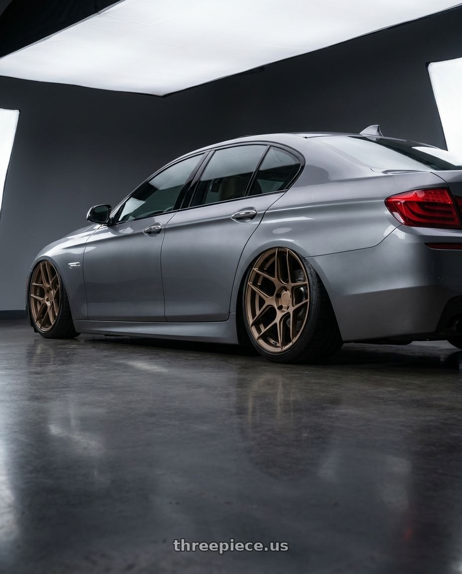 2016 BMW 5 Series F10 with Aodhan AFF2 5x120 20x9+30 Matte Bronze wheels rear three quarter view slight stretch tires