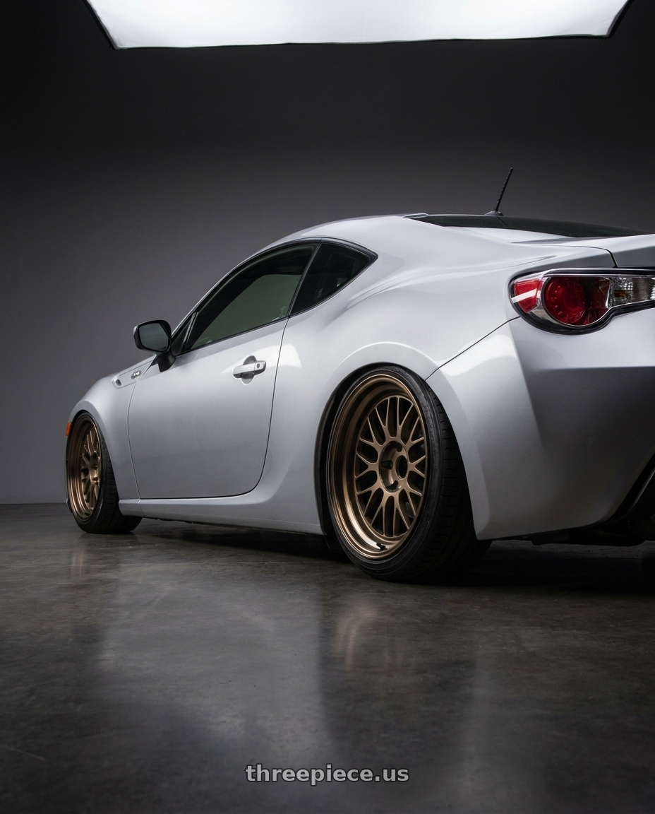 2014 Toyota 86 with Volk Racing 21A 5x100 18X9+0  Bronze wheels rear three quarter view slight stretch tires
