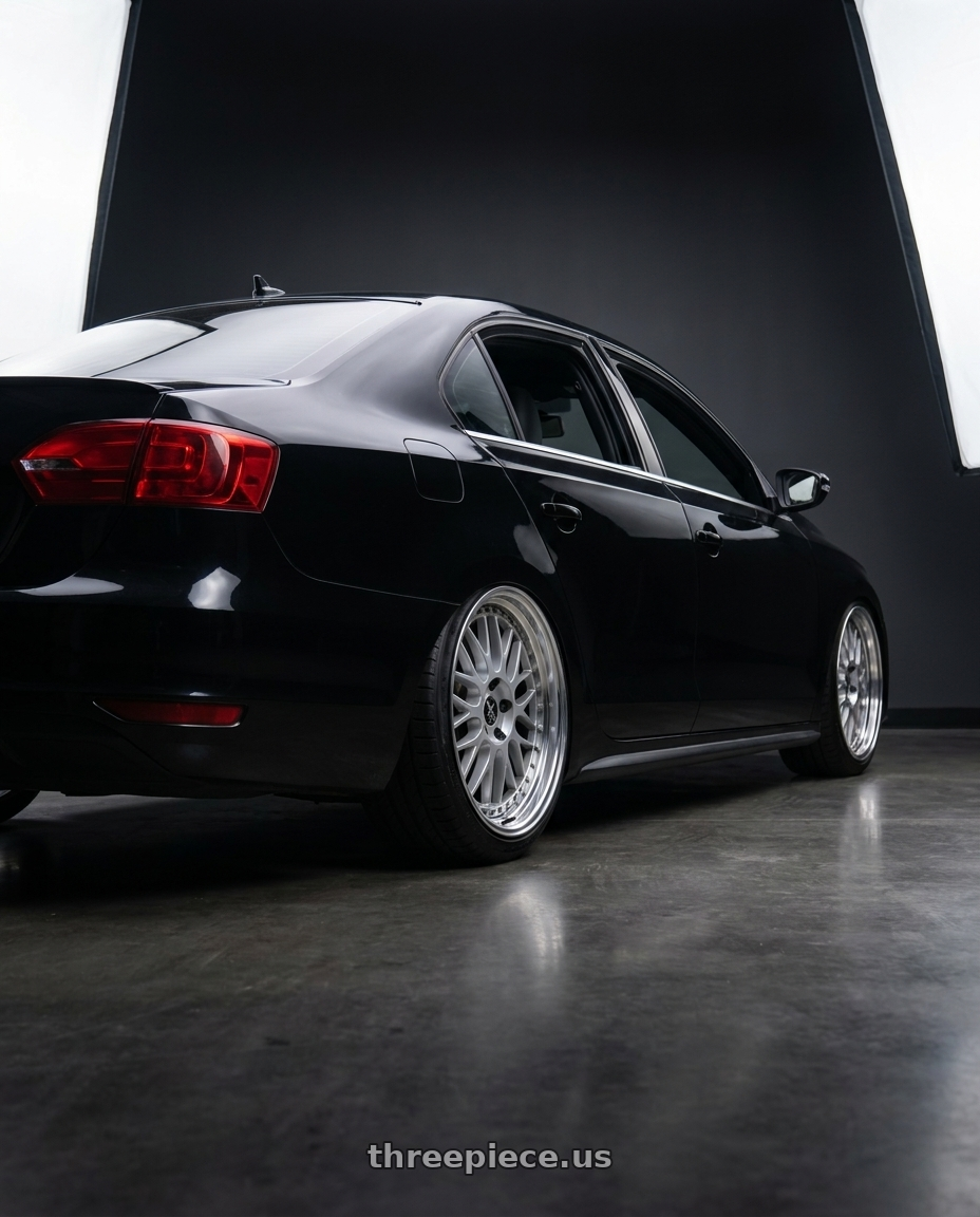 2012 Volkswagen Jetta GLI with Work Vs-Xx 5x100 18x8.5+32 A Disk Light Grey Silver wheels rear three quarter view slight stretch tires