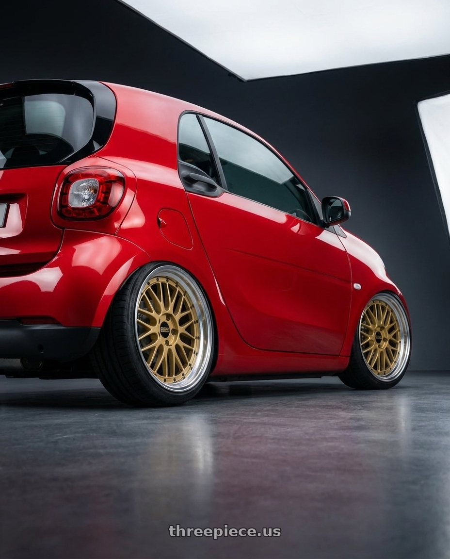 2026 Smart 2 with BBS LM 5x114.3 18x9.0+42 Gold wheels rear three quarter view slight stretch tires